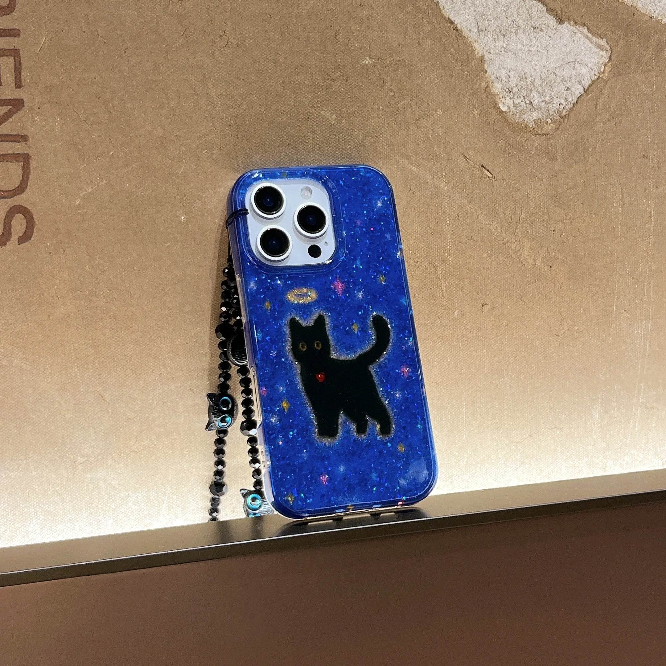 Cute Phone Cases For iPhone 16, 15, 14, 13 Pro Max - Glittering Blue Background Black Cat Pattern - Cover With Wrist Chain - PC6530 - Touchy Style